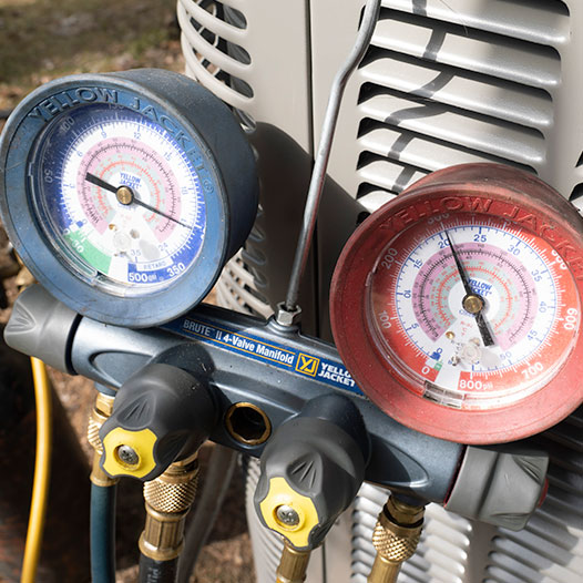 AC pressure gauge connected to AC unit 