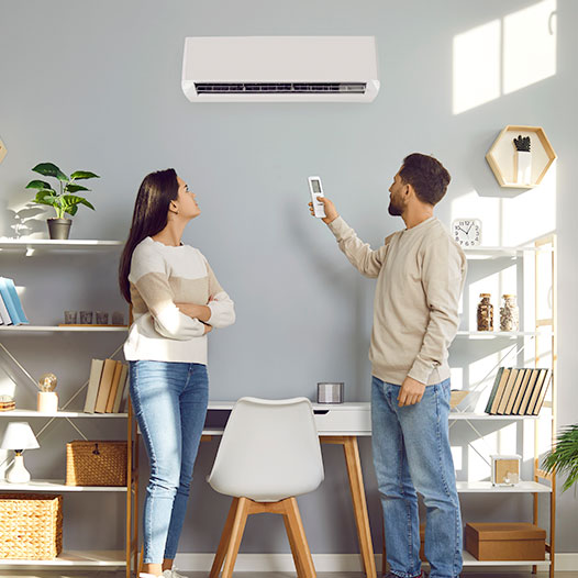 couple adjusting ductless fan